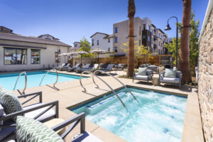 Pool with lounge chairs at Kendry apartments near Chino, CA.