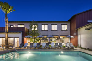 Pool with lounge chairs at Kendry apartments near Chino, CA.