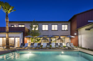 Pool with lounge chairs at Kendry apartments near Chino, CA.